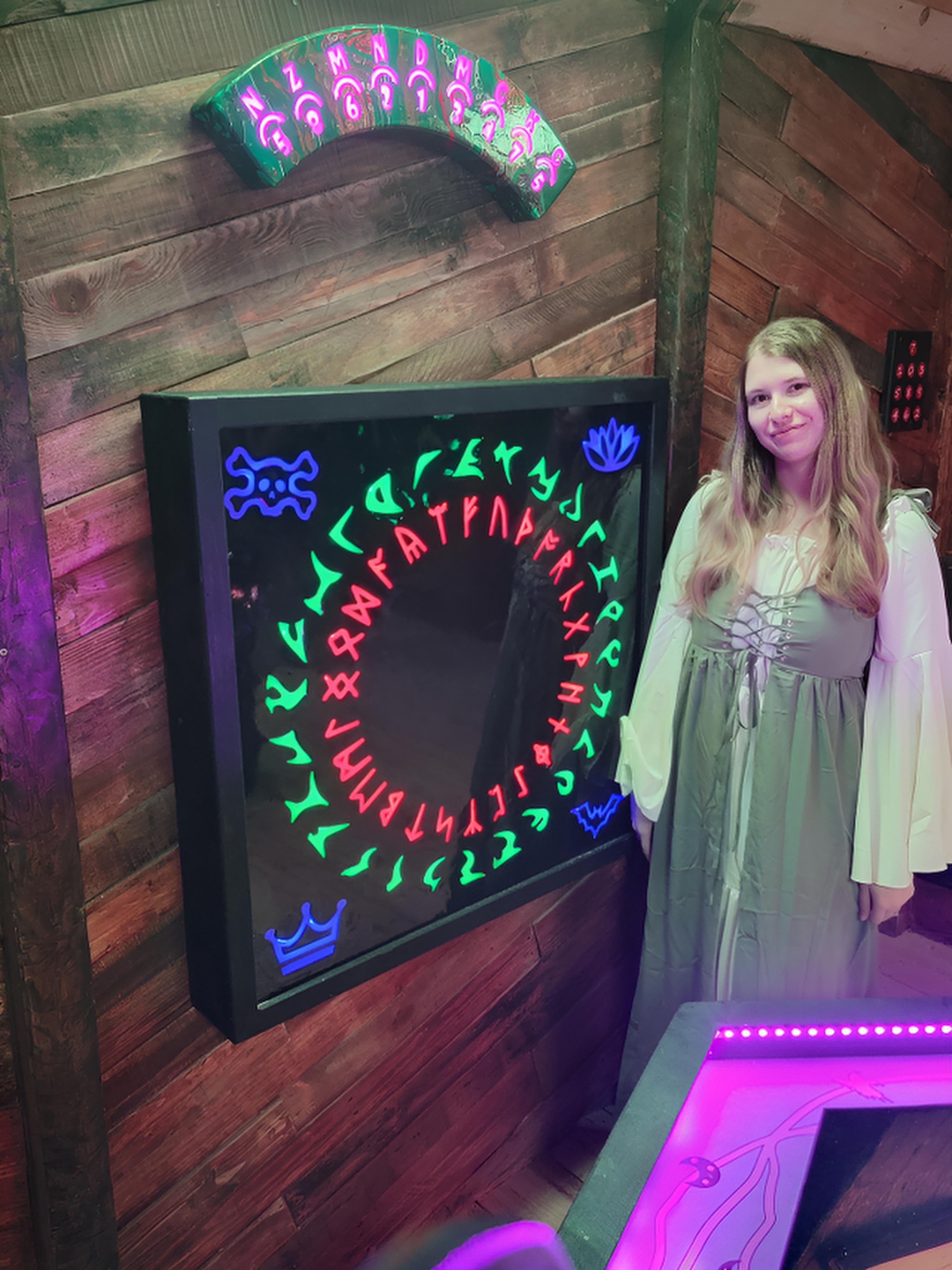A guest investigating magical symbols inside Witch's Cauldron